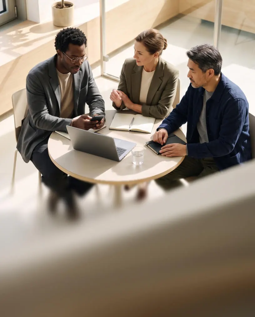 A commercial team working around a table