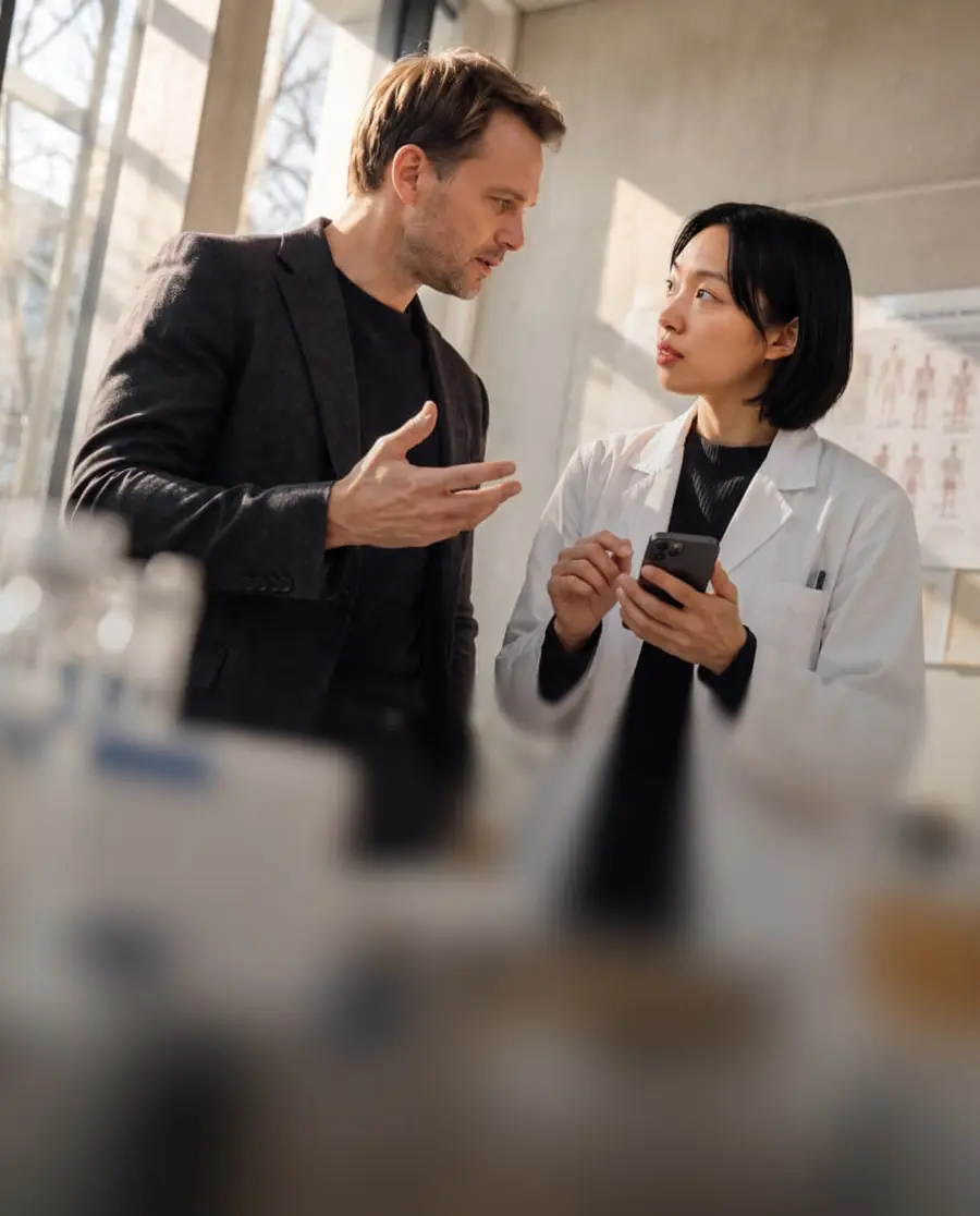 A sales representative in conversation with a physician